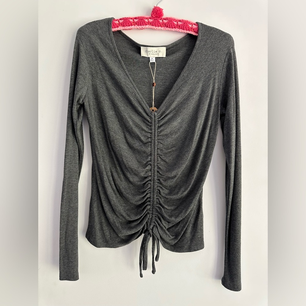 Grey long-sleeved knit top with cinch.